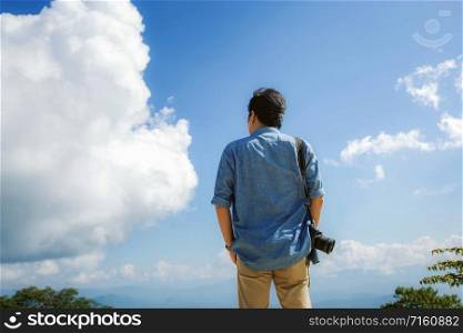 Photographer of traveler in summer with the blue sky.