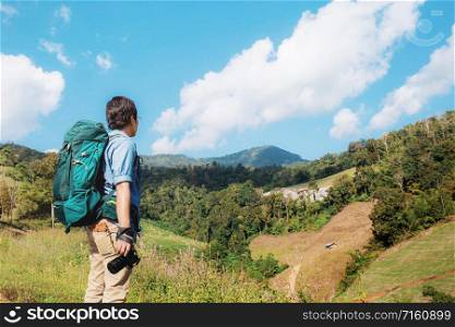 Photographer of traveler on mountain in summer.