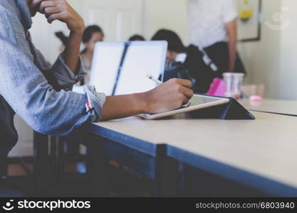 photographer retouching photo, graphic designer drawing image using a digital tablet, pen and computer laptop