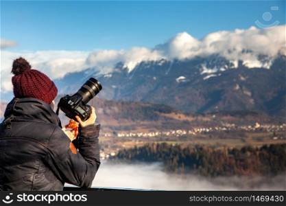 photographer woman taking photos of Bled island