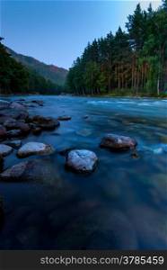 photographing flowing river early in the morning, Altai Krai