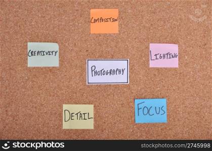 photography concept with essential aspects written on colorful note papers (bulletin board)