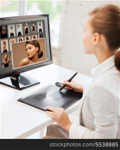 photography, office and magazine concept - female retoucher with drawing tablet and computer working at home or office