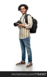 photography, profession and people and concept - happy smiling man or photographer in glasses with digital camera and backpack over white background. smiling man or photographer with digital camera