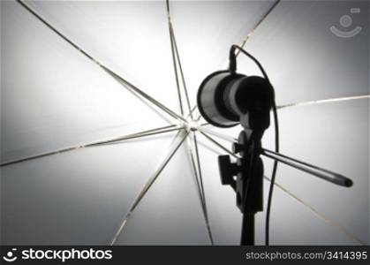 Photography set up with umbrella reflecting modeling lamp