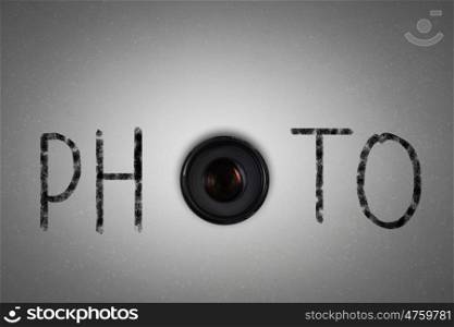 Photography. Word photo with camera zoom instead of letter O