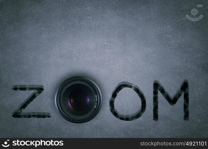 Photography. Word zoom with camera zoom instead of letter O