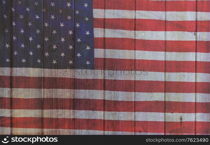 Photomerged background of American flag, USA stars and stripes, with wooden planks fence or panelling background