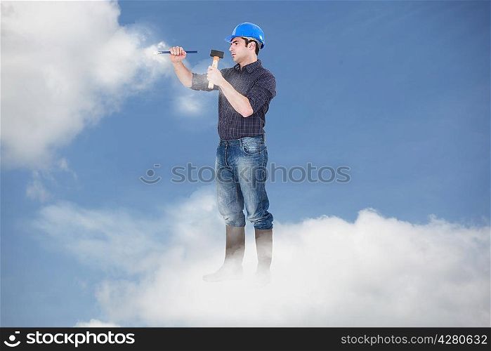 Photomontage of a workman driving a nail in the clouds