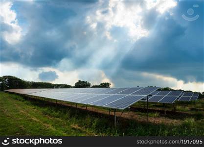 Photovoltaic modules solar power plant with Puffy fluffy white clouds blue sky daylight background, clean Alternative power energy concept.