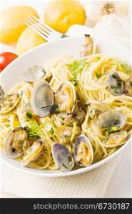 phto of delicious pasta with clams on white background