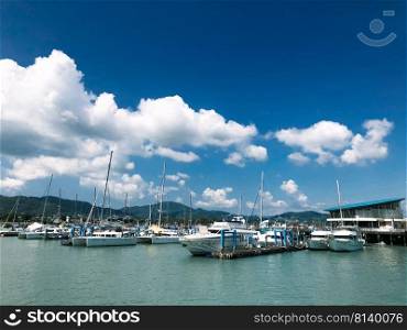 Phuket, Thailand - November 19, 2019    Thai fishing boat for trophy fishing and vacation at sea. High speed boats in the marina of Phuket, waiting for tourists going fishing 