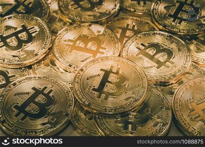 Physical Bitcoin pile background - Bitcoin mining business is the process of adding transaction records to Bitcoin public ledger of past transactions or blockchain. Cryptocurrency trading concept.