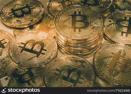 Physical Bitcoin pile background - Bitcoin mining business is the process of adding transaction records to Bitcoin public ledger of past transactions or blockchain. Cryptocurrency trading concept.