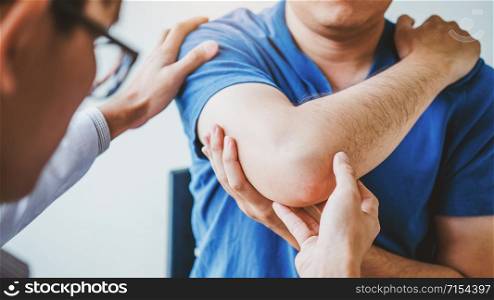 Physical Doctor consulting with patient About elbow muscule pain problems Physical therapy diagnosing concept