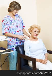 Physical therapist uses ultrasound to relief chiropractic patient&rsquo;s neck pain.