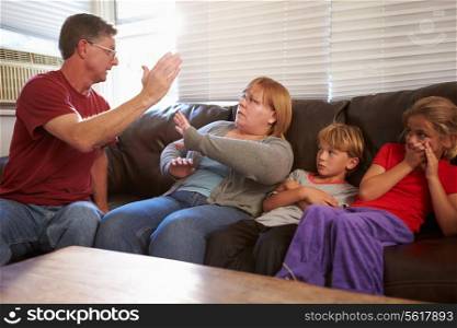 Physically Abusive Father With Family On Sofa