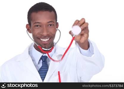 Physician holding up a stethoscope
