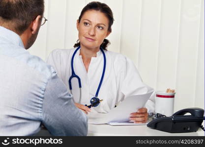 physician in medical practice with patients. interview and counseling treatment.