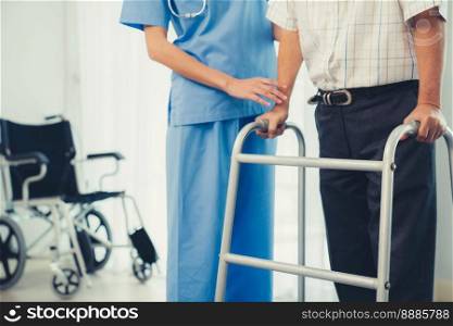 Physiotherapist assists her contented senior patient on folding walker. Recuperation for elderly, seniors care, nursing home.. Physiotherapist assists her contented senior patient on folding walker.