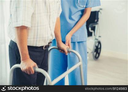 Physiotherapist assists her contented senior patient on folding walker. Recuperation for elderly, seniors care, nursing home.. Physiotherapist assists her contented senior patient on folding walker.