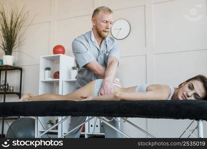 physiotherapist female patient during physical therapy session