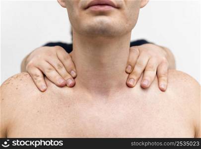 physiotherapist massaging man s neck