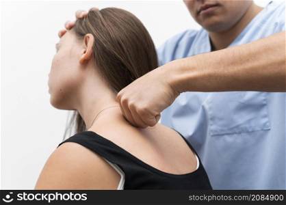 physiotherapist massaging woman s upper back