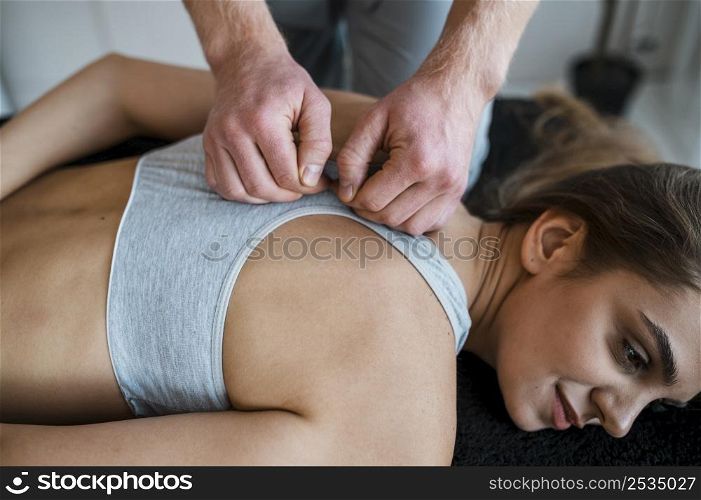 physiotherapist woman during session physical therapy