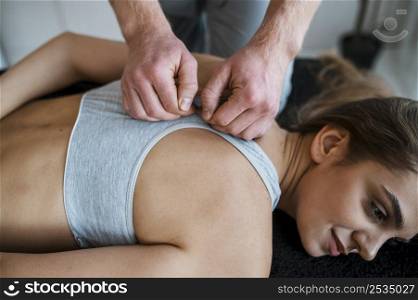 physiotherapist woman during session physical therapy
