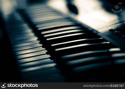 Piano keyboard close up view with shallow depth of field focus.