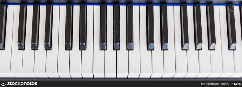 Piano Keyboard synthesizer closeup key top view