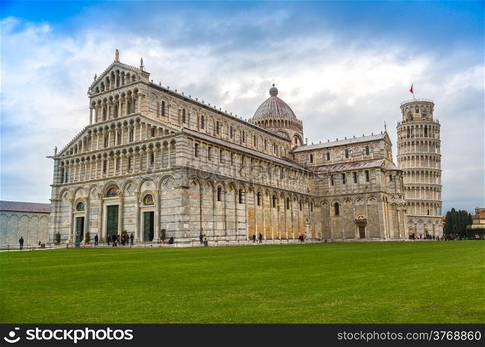 Piazza dei Miracoli complex with the leaning tower of Pisa in front, Italy