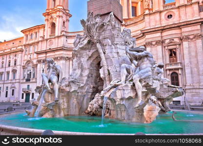 Piazza Navona square Fontana dei Fiumi and church dawn view, Rome, capital of Italy