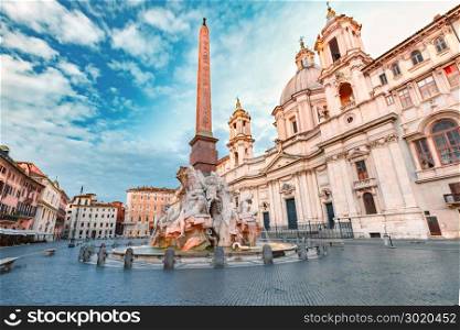 Piazza Navona Square in the morning, Rome, Italy.. Fountain of the Four Rivers with an Egyptian obelisk and Sant Agnese Church on the famous Piazza Navona Square in the morning, Rome, Italy.