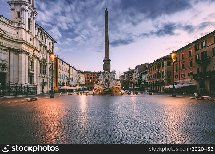 Piazza Navona Square in the morning, Rome, Italy.. Fountain of the Four Rivers with an Egyptian obelisk on the famous Piazza Navona Square in the morning, Rome, Italy.