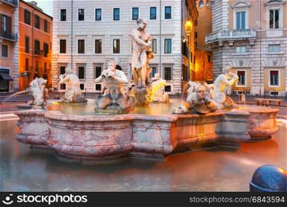 Piazza Navona Square in the morning, Rome, Italy.. Fontana del Moro with four Tritons sculpted on the famous Piazza Navona Square during morning blue hour, Rome, Italy.