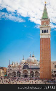 Piazza San Marco with the Basilica of Saint Mark and the bell tower of St Mark's Campanile (Campanile di San Marco) in Venice, Italy, September 09, 2015.