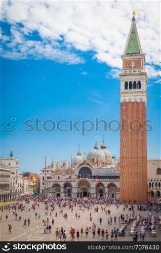 Piazza San Marco with the Basilica of Saint Mark and the bell tower of St Mark's Campanile (Campanile di San Marco) in Venice, Italy, September 09, 2015.