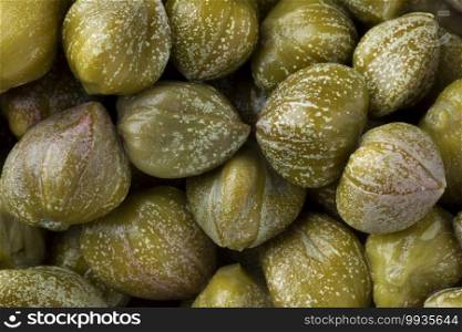 Pickled capers close up full frame as background 