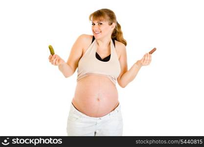 Pickles or chocolate? Beautiful pregnant woman making choice isolated on white&#xA;