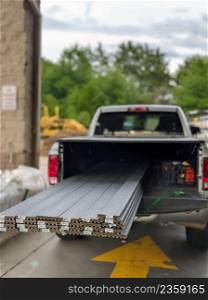 pickup truck loaded with coposide decking