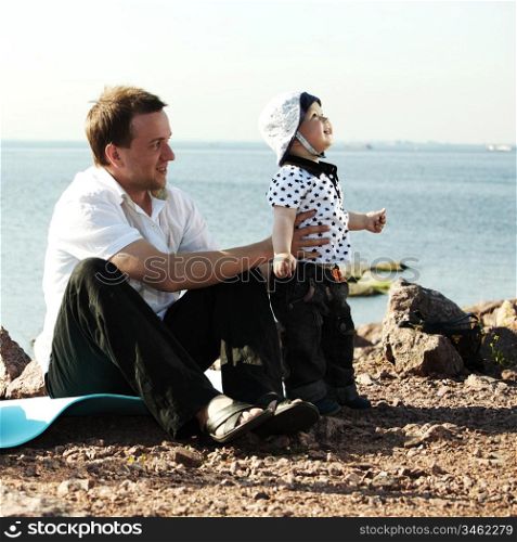 picnic of happy family near sea