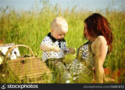 picnic of happy family on green grass