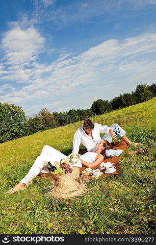 Picnic - Romantic couple in spring nature on sunny day