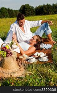 Picnic - Romantic couple in spring nature on sunny day