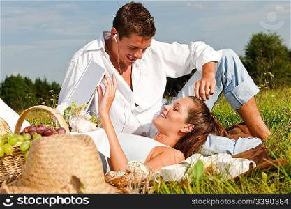 Picnic - Romantic couple in spring nature on sunny day