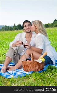 Picnic - Romantic happy couple celebrating with wine in sunny nature