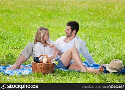 Picnic - Romantic happy couple in meadows nature sunny day