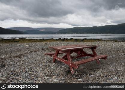Picnic Table on the pebbled beach, Bonne Bay, Norris Point, Gros Morne National Park, Newfoundland And Labrador, Canada
